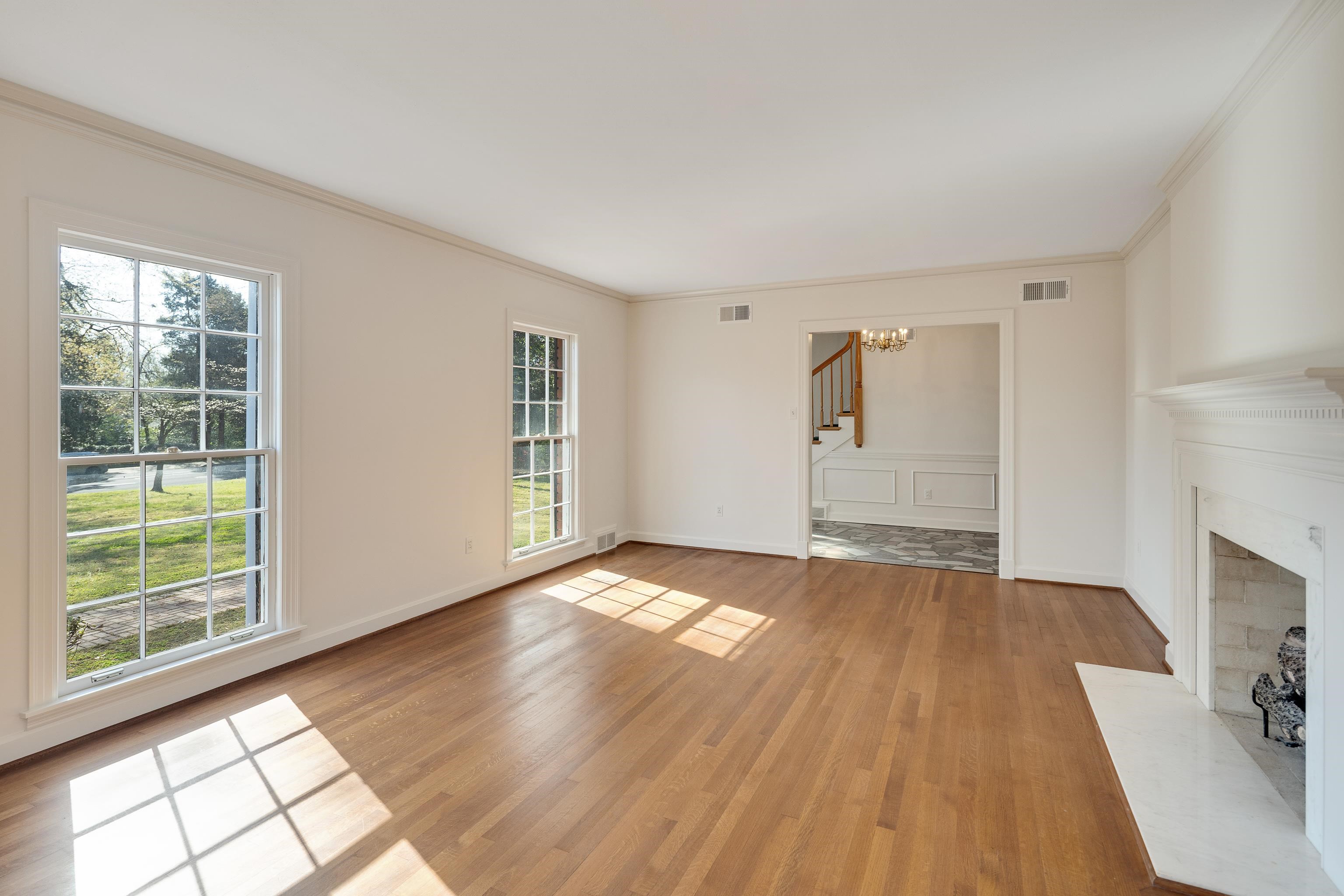 685 South Perkins Road Memphis, TN 38117 - Photo 6 of 40 a view of an empty room with a window and wooden floor