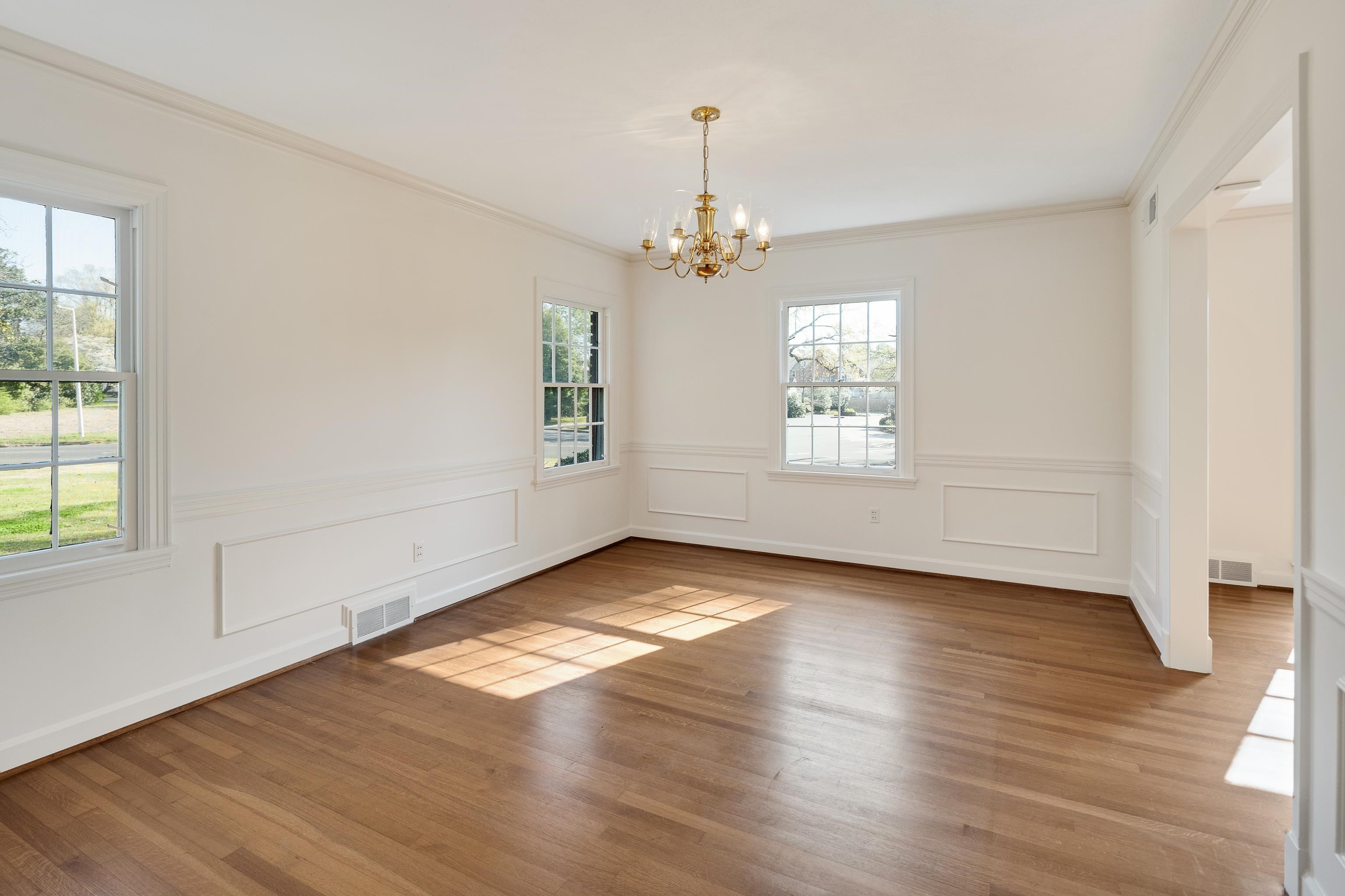 685 South Perkins Road Memphis, TN 38117 - Photo 10 of 40 an empty room with wooden floor chandelier and windows