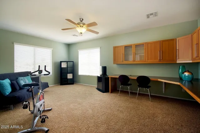 a kitchen with a cabinets and chairs