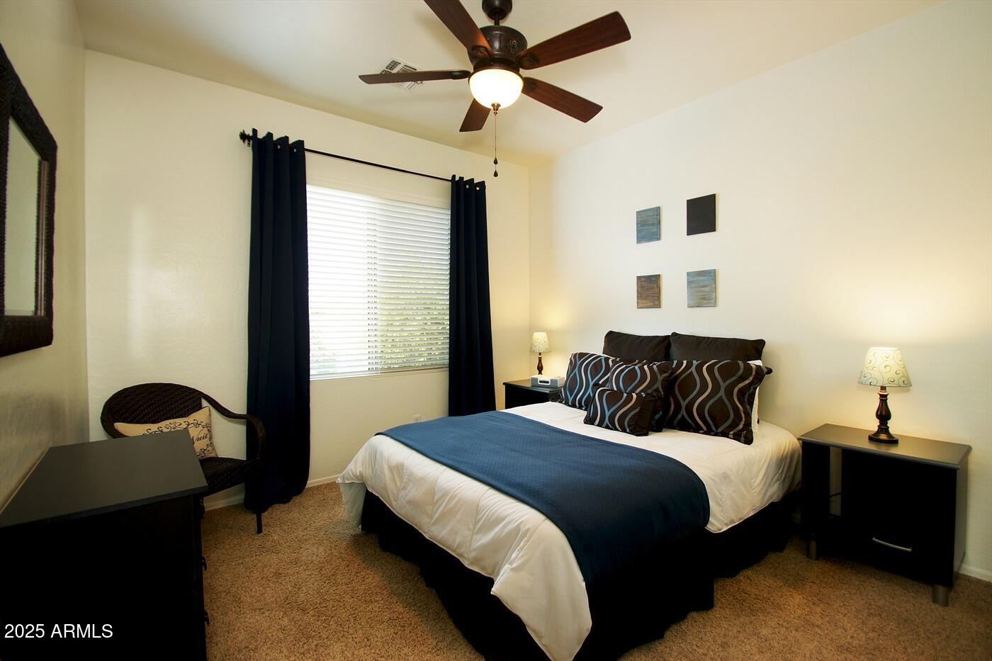 239 West Desert Avenue Gilbert, AZ 85233 - Photo 19 of 38 a bedroom with bed and a chandelier