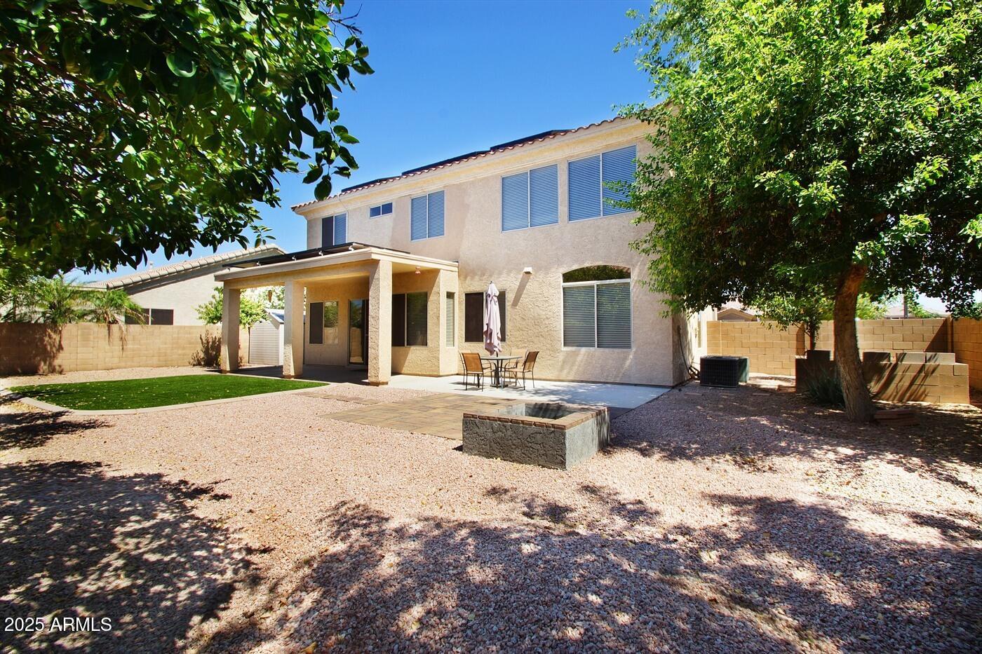 239 West Desert Avenue Gilbert, AZ 85233 - Photo 21 of 38 a front view of a house with a yard