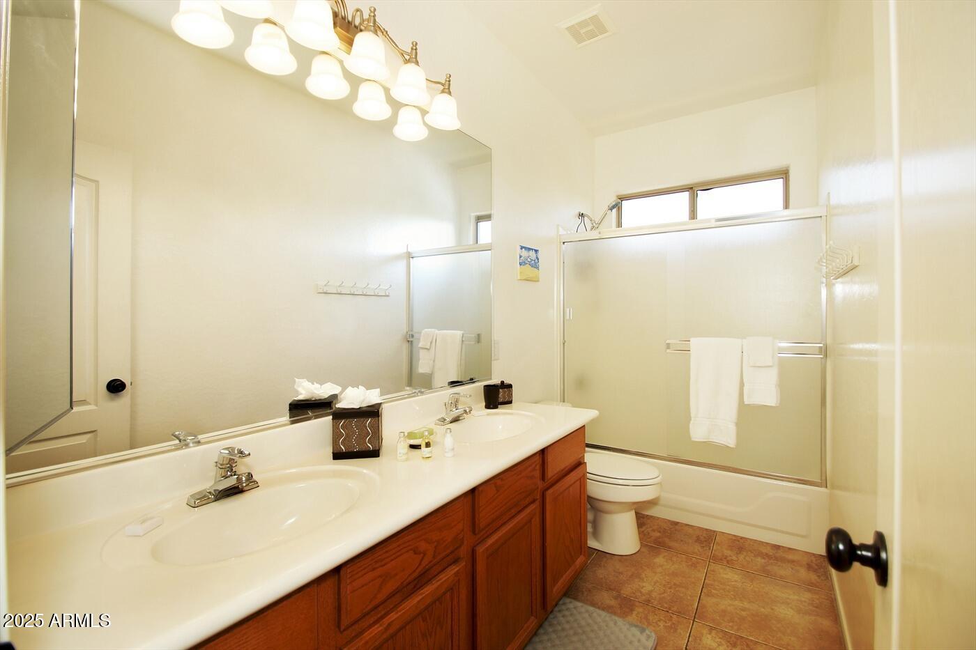239 West Desert Avenue Gilbert, AZ 85233 - Photo 27 of 38 a bathroom with a double vanity sink mirror and toilet