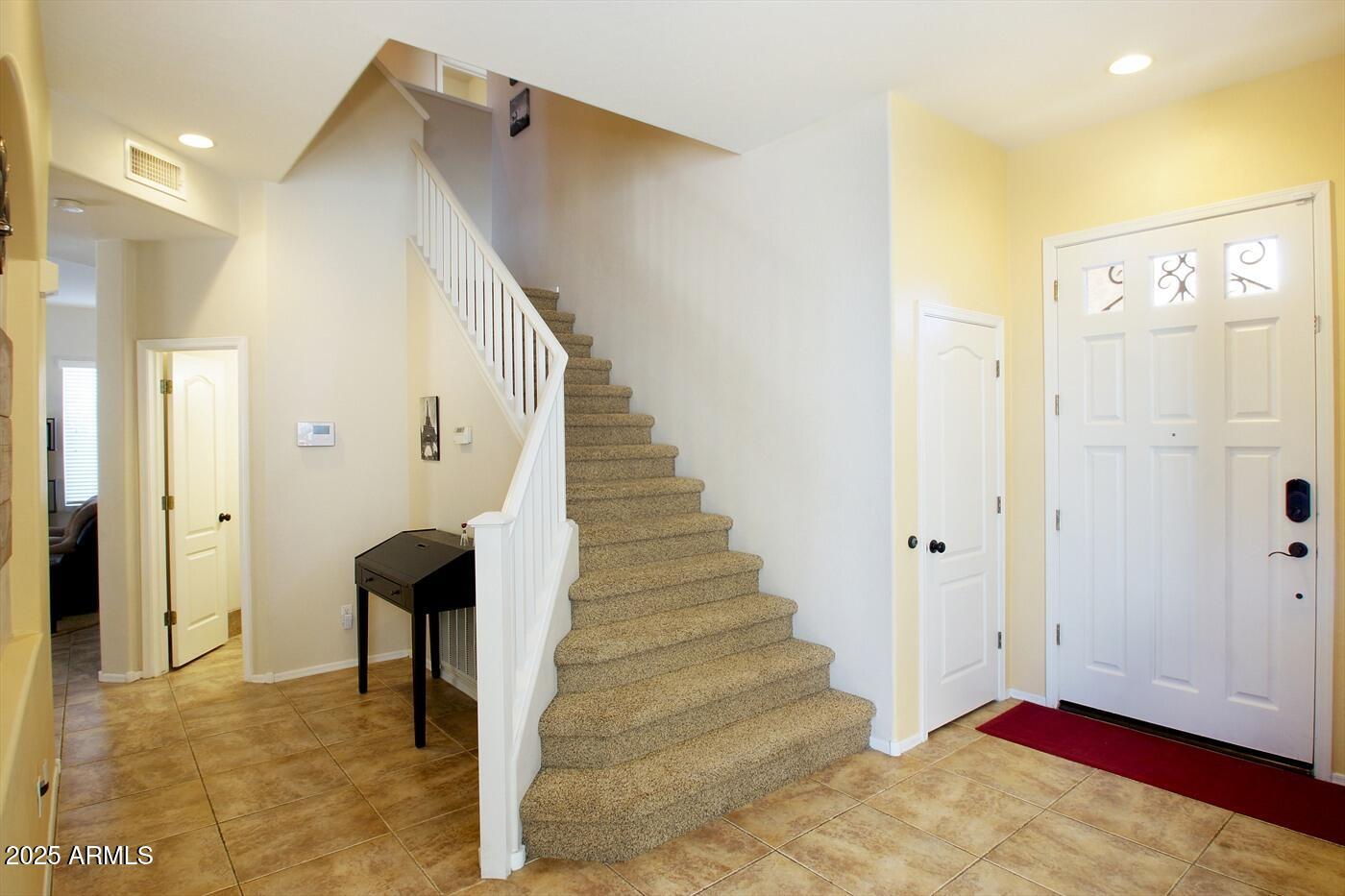 239 West Desert Avenue Gilbert, AZ 85233 - Photo 28 of 38 a view of entryway and hall with wooden floor