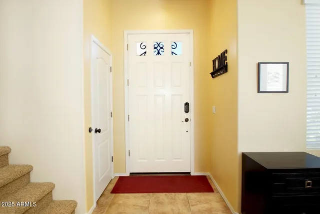 a bathroom with a sink mirror and toilet