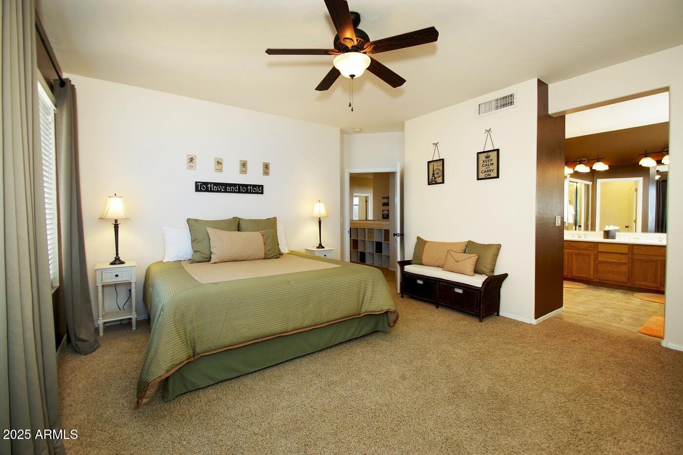 239 West Desert Avenue Gilbert, AZ 85233 - Photo 36 of 38 a spacious bedroom with a bed and ceiling fan