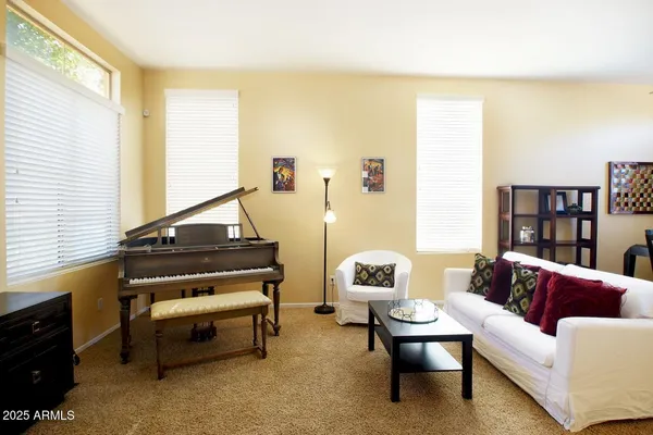 a living room with furniture and a window