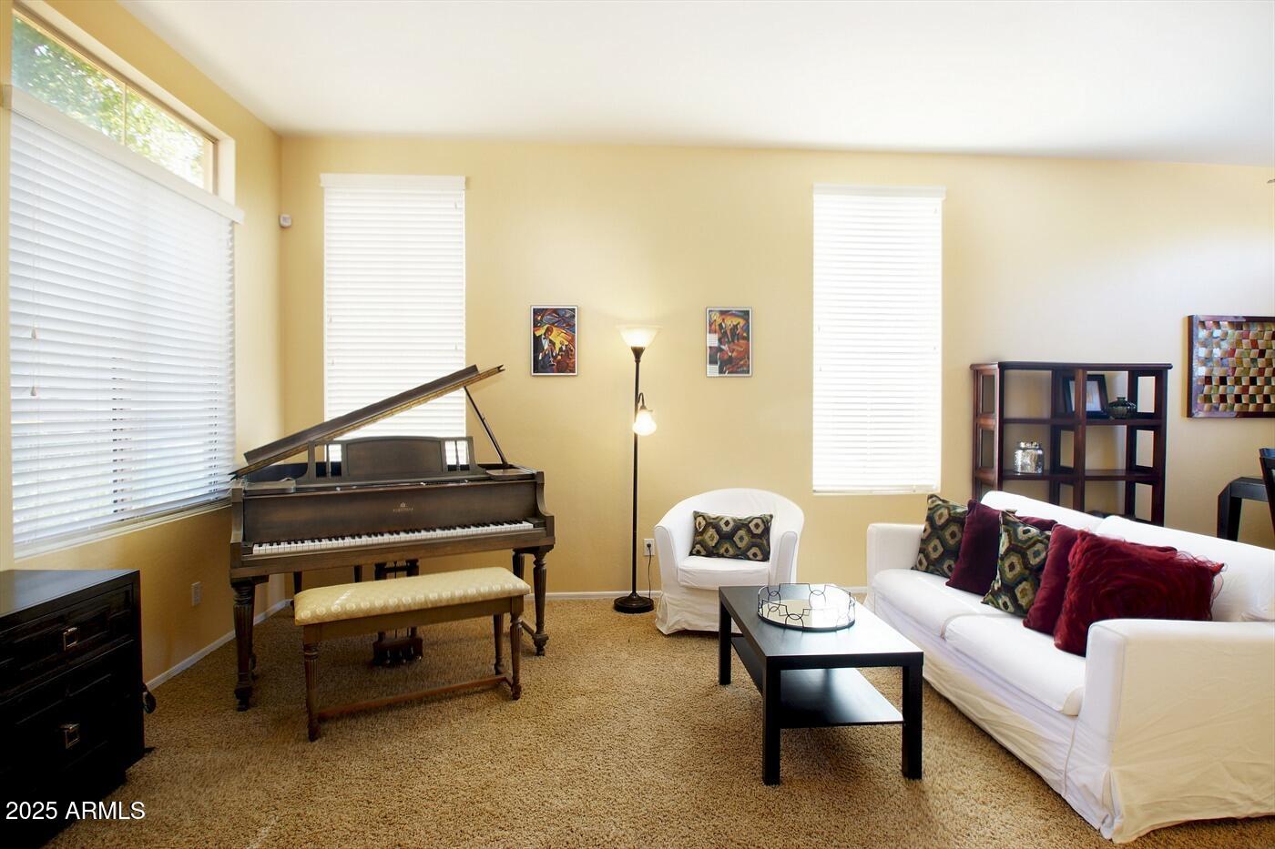 239 West Desert Avenue Gilbert, AZ 85233 - Photo 4 of 38 a living room with furniture and a window