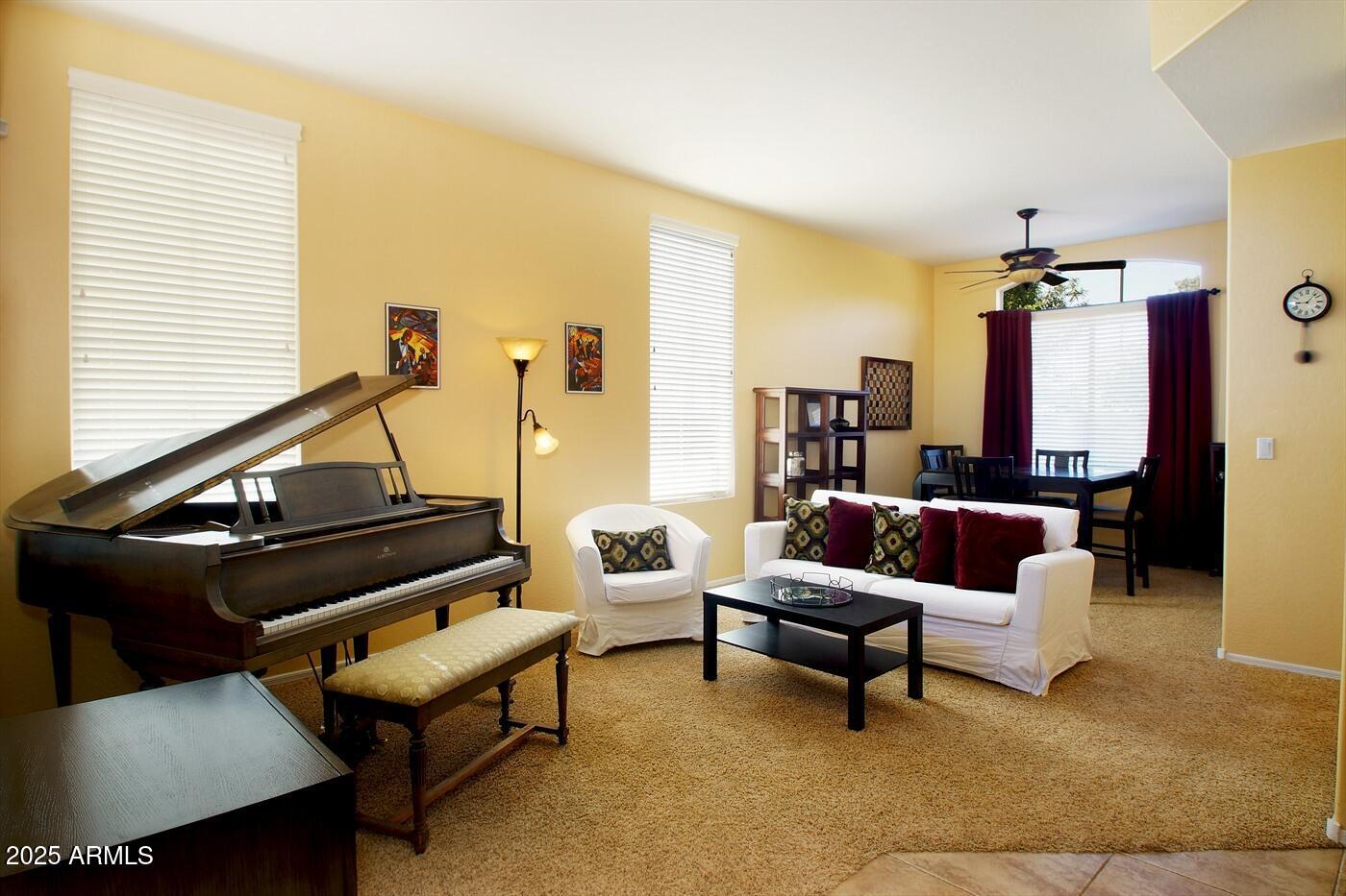 239 West Desert Avenue Gilbert, AZ 85233 - Photo 5 of 38 a living room with furniture and a chandelier