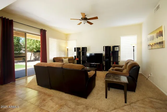 a view of a dining room with furniture and a window