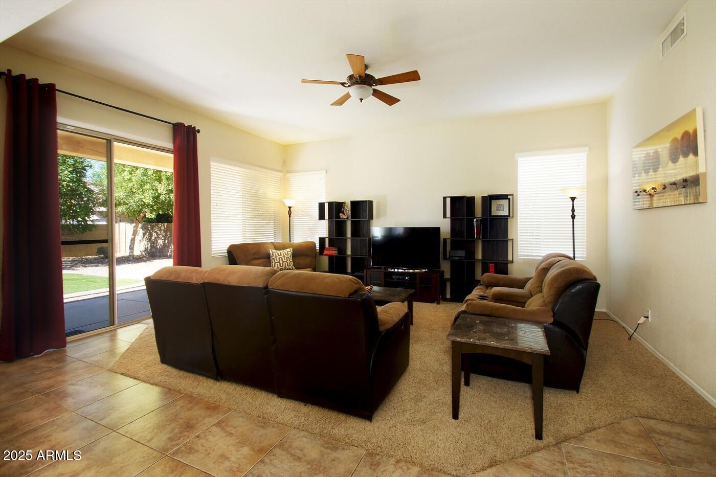 239 West Desert Avenue Gilbert, AZ 85233 - Photo 8 of 38 a living room with furniture and a window