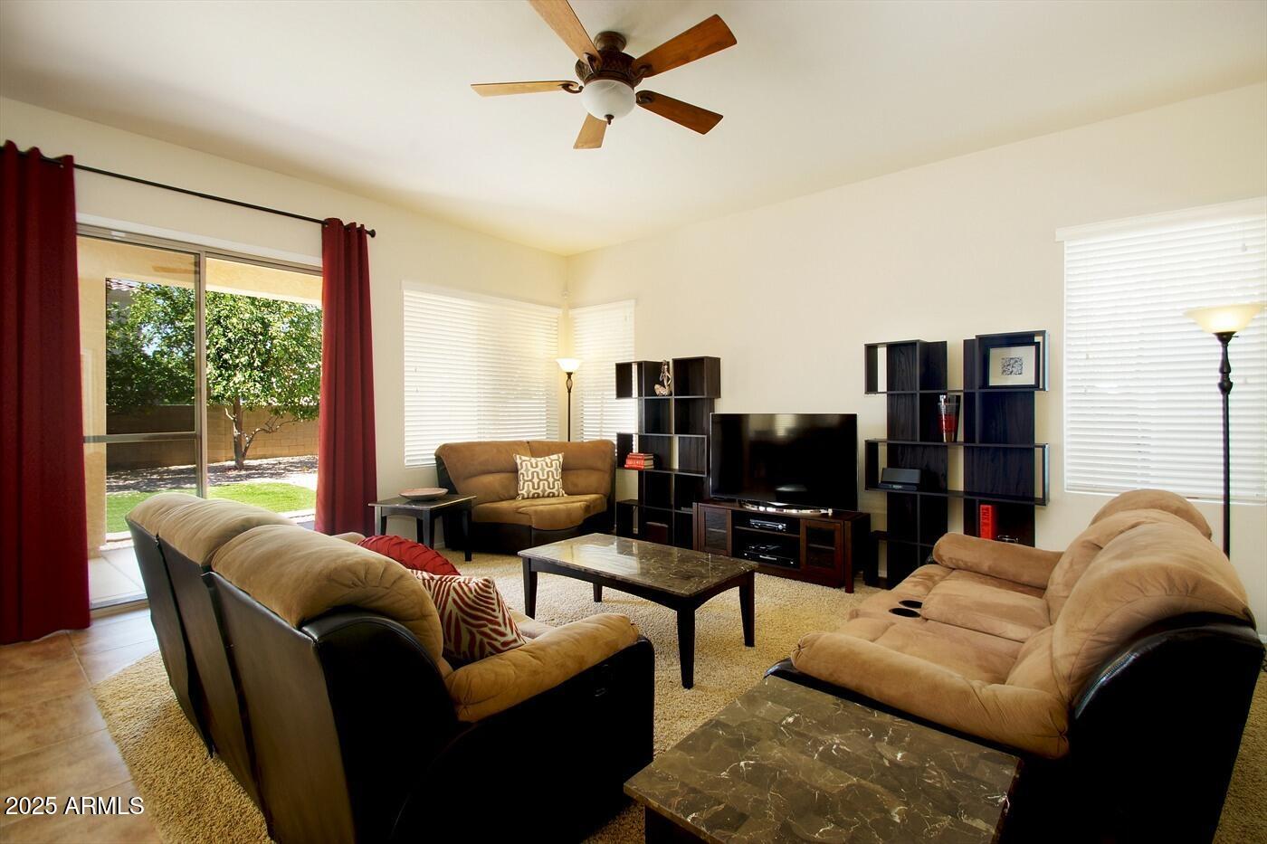 239 West Desert Avenue Gilbert, AZ 85233 - Photo 10 of 38 a living room with furniture and a flat screen tv