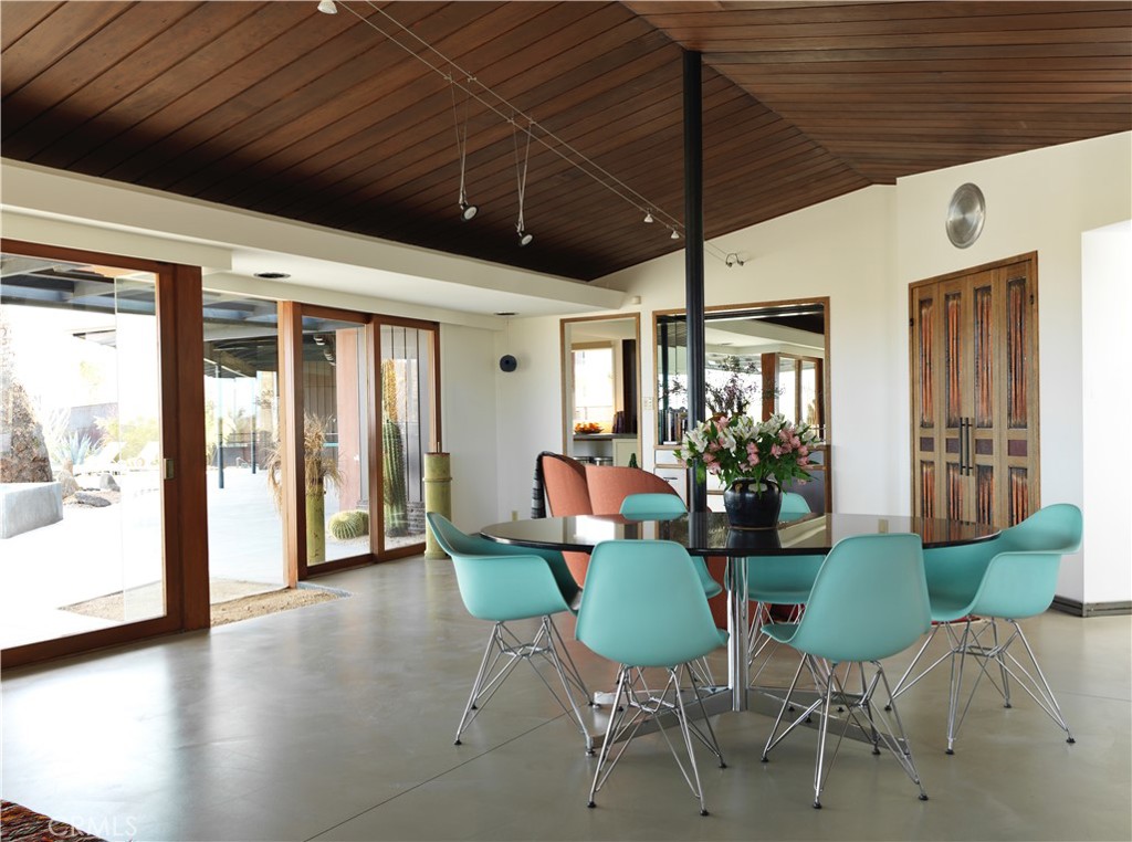 5960 Sunrise Road Twentynine Palms, CA 92277 - Photo 19 of 65 a view of a dining room with furniture window and wooden floor