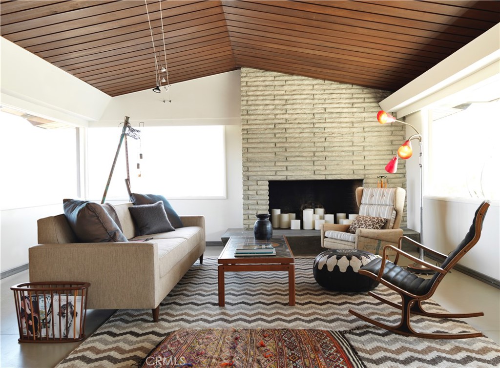 5960 Sunrise Road Twentynine Palms, CA 92277 - Photo 20 of 65 a living room with furniture and a fireplace