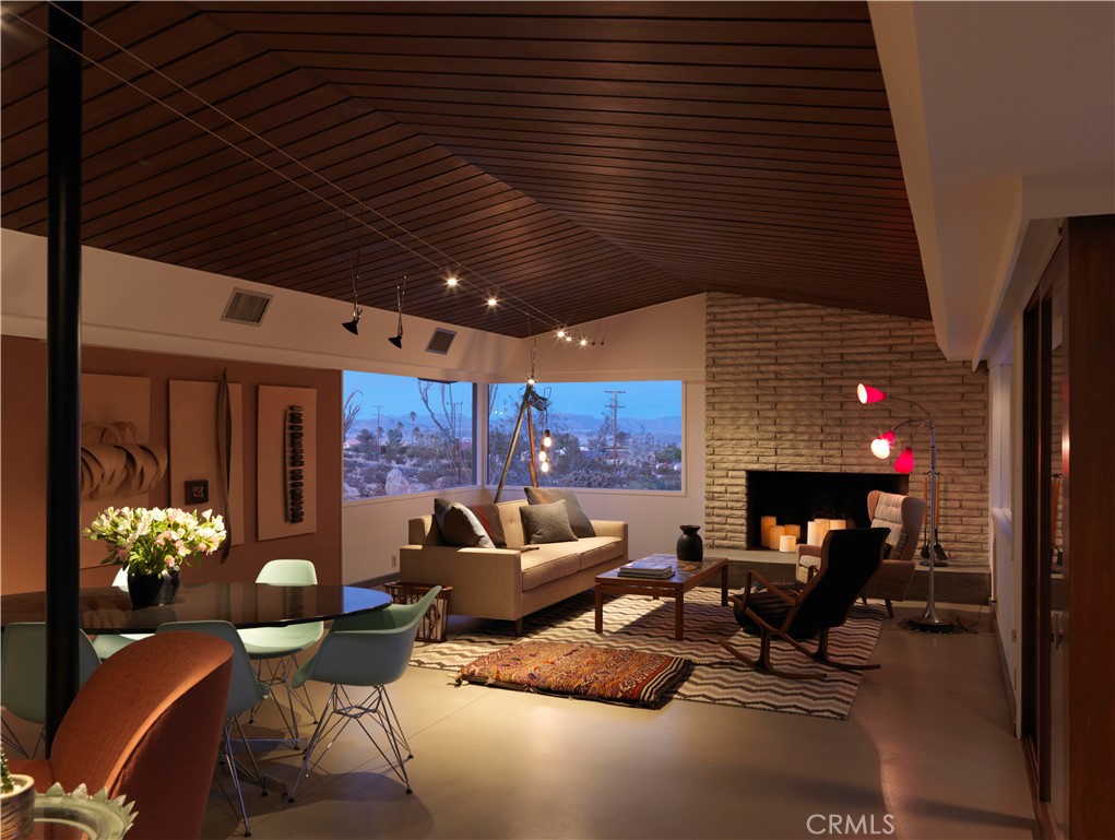 5960 Sunrise Road Twentynine Palms, CA 92277 - Photo 21 of 65 a living room with furniture and a potted plant