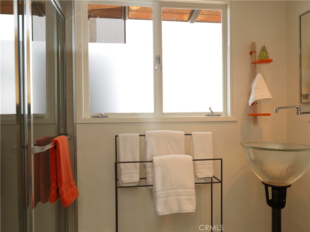 5960 Sunrise Road Twentynine Palms, CA 92277 - Photo 31 of 65 a bathroom with a sink and a mirror