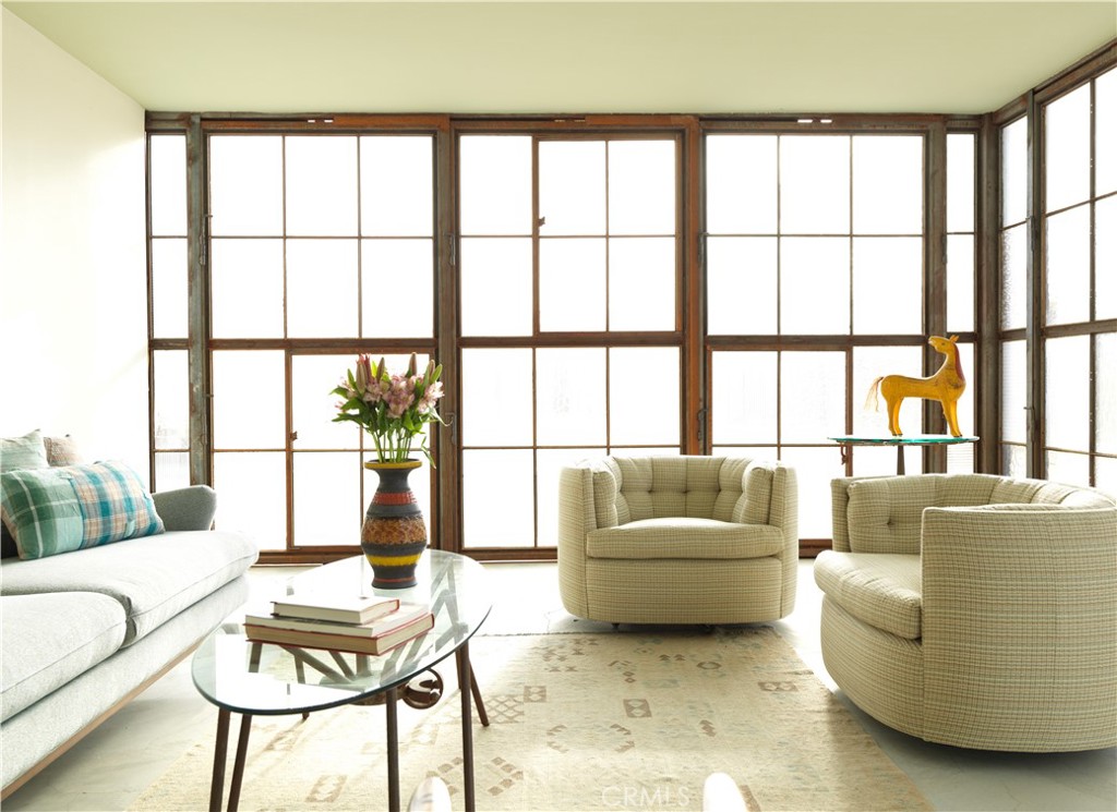 5960 Sunrise Road Twentynine Palms, CA 92277 - Photo 38 of 65 a living room with furniture and a large window