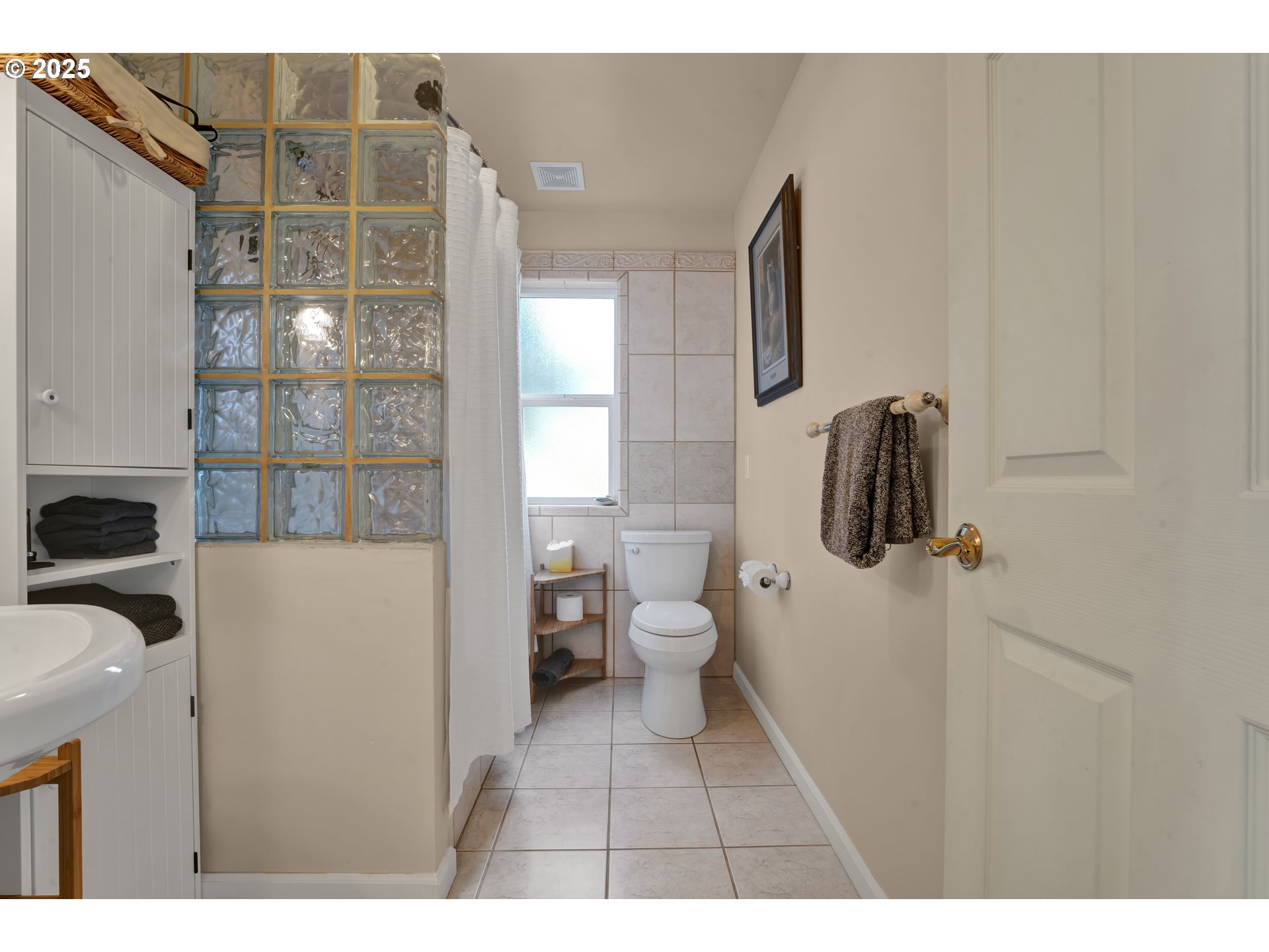 4567 Heceta Street Florence, OR 97439 - Photo 13 of 46 a bathroom with a sink toilet and shower