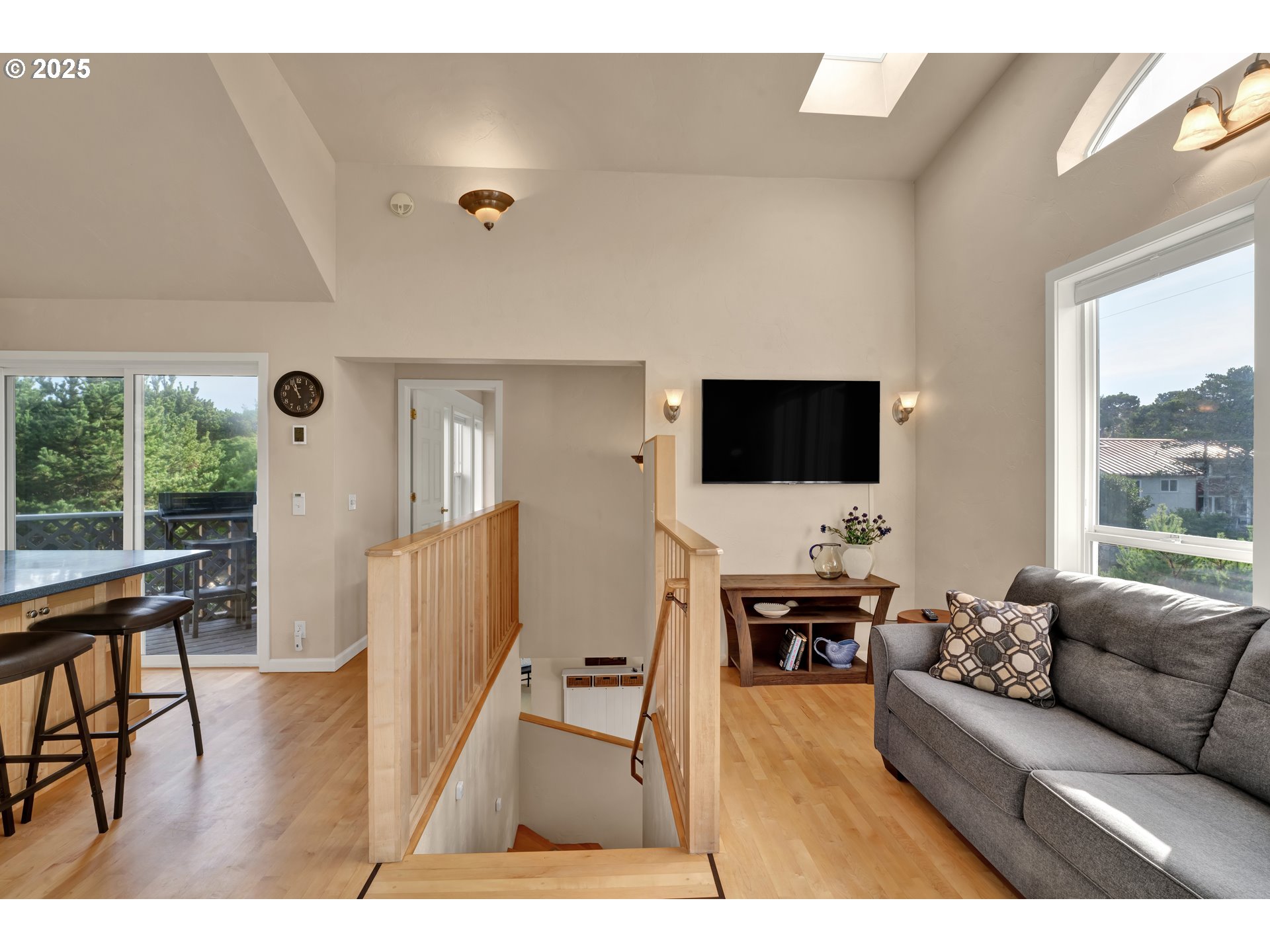 4567 Heceta Street Florence, OR 97439 - Photo 25 of 46 a living room with furniture wooden floor and a flat screen tv