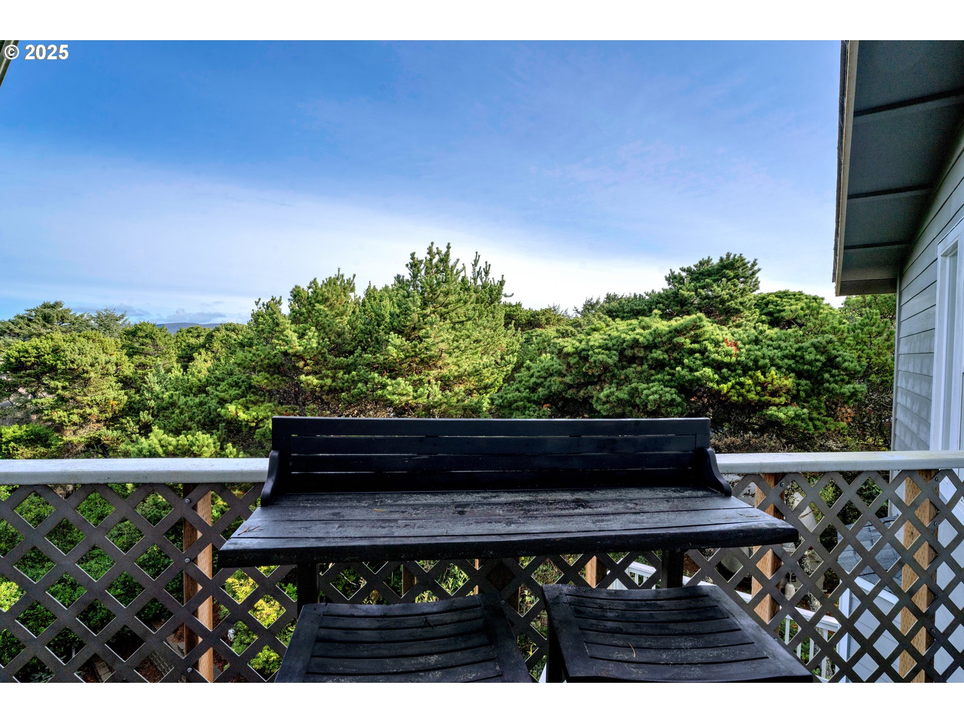 4567 Heceta Street Florence, OR 97439 - Photo 27 of 46 a view of a wooden bench in a backyard