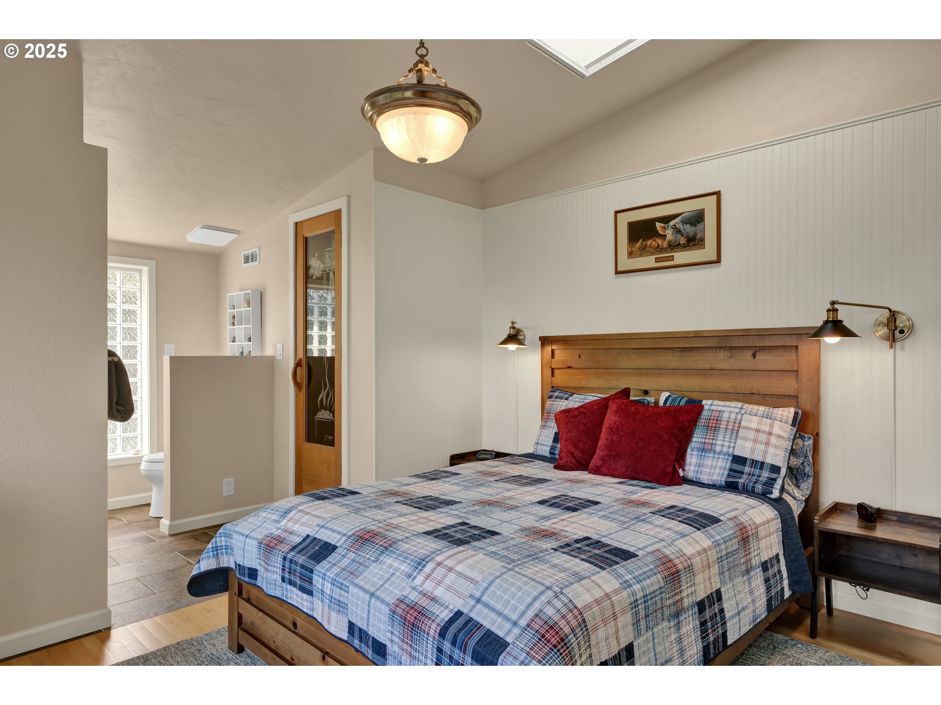 4567 Heceta Street Florence, OR 97439 - Photo 28 of 46 a bedroom with a bed and painting on the wall