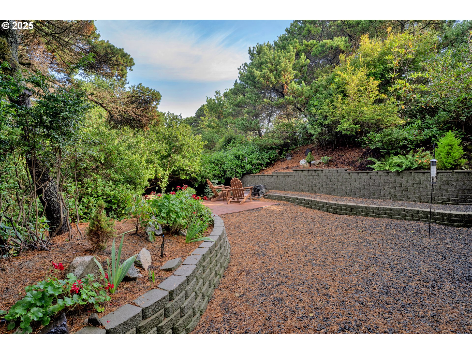 4567 Heceta Street Florence, OR 97439 - Photo 38 of 46 a backyard of a house with lots of green space