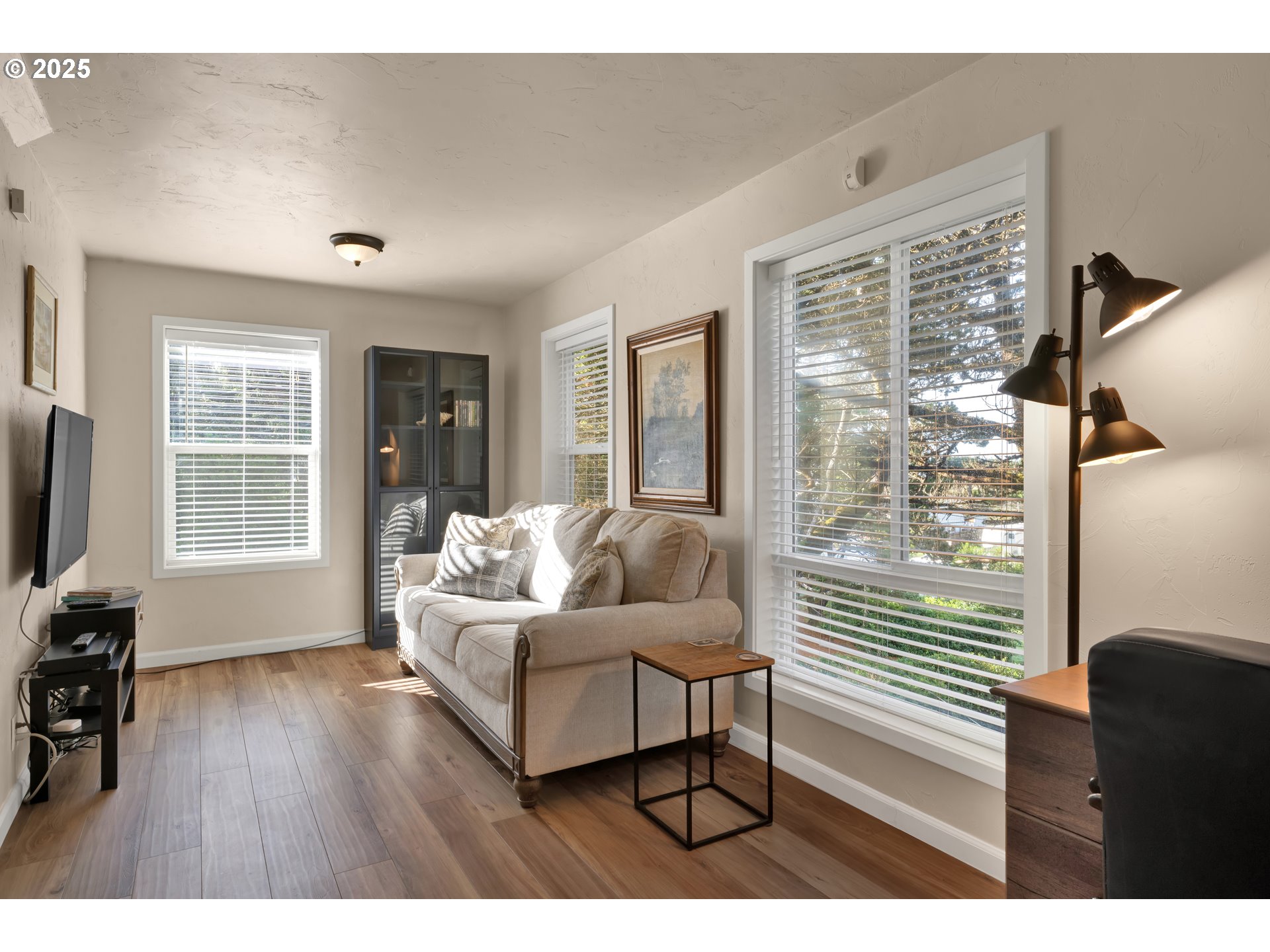 4567 Heceta Street Florence, OR 97439 - Photo 6 of 46 a living room with furniture and a flat screen tv