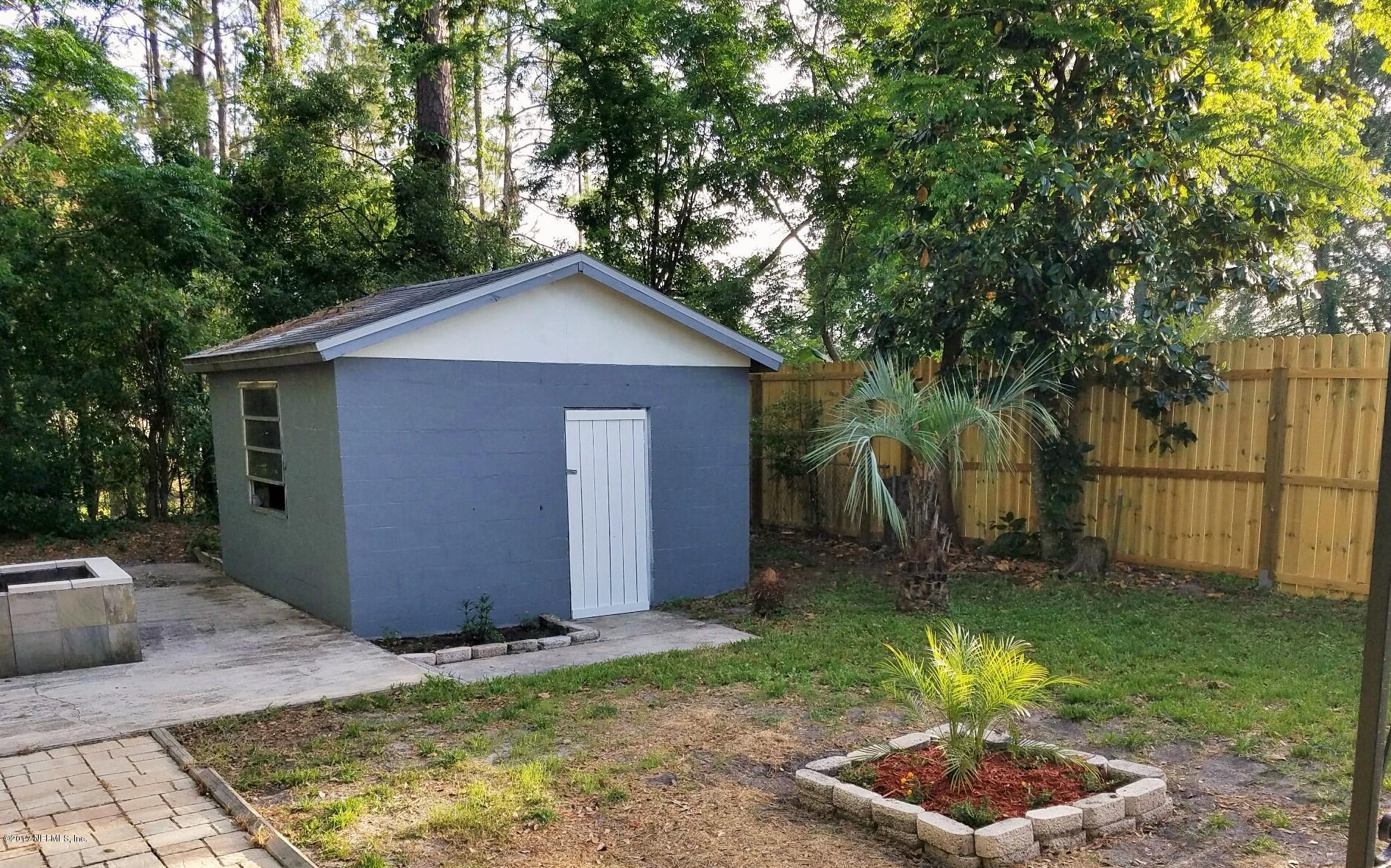 6556 Todd Road Jacksonville, FL 32216 - Photo 15 of 17 a front view of a house with a yard