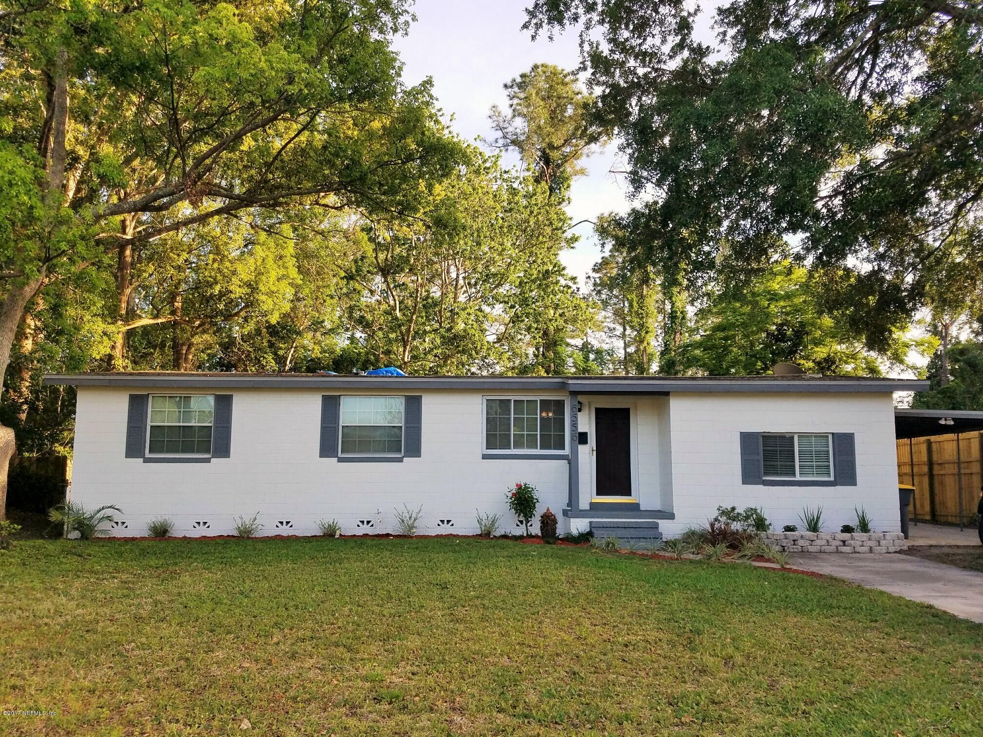 6556 Todd Road Jacksonville, FL 32216 - Photo 16 of 17 a backyard of a house with seating space