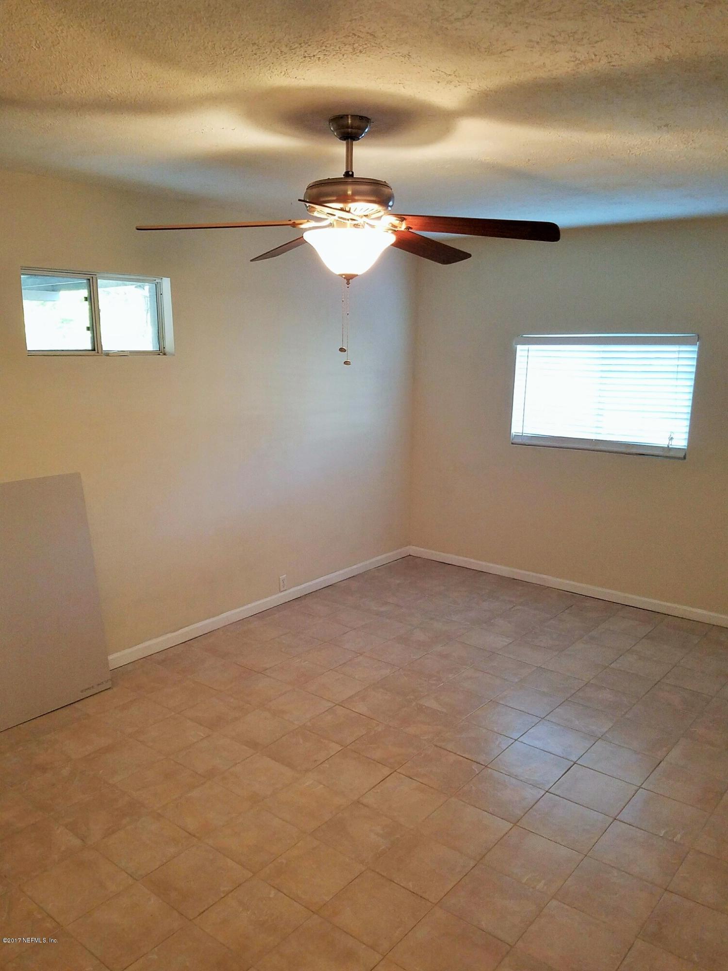 6556 Todd Road Jacksonville, FL 32216 - Photo 6 of 17 a view of a ceiling fan and window