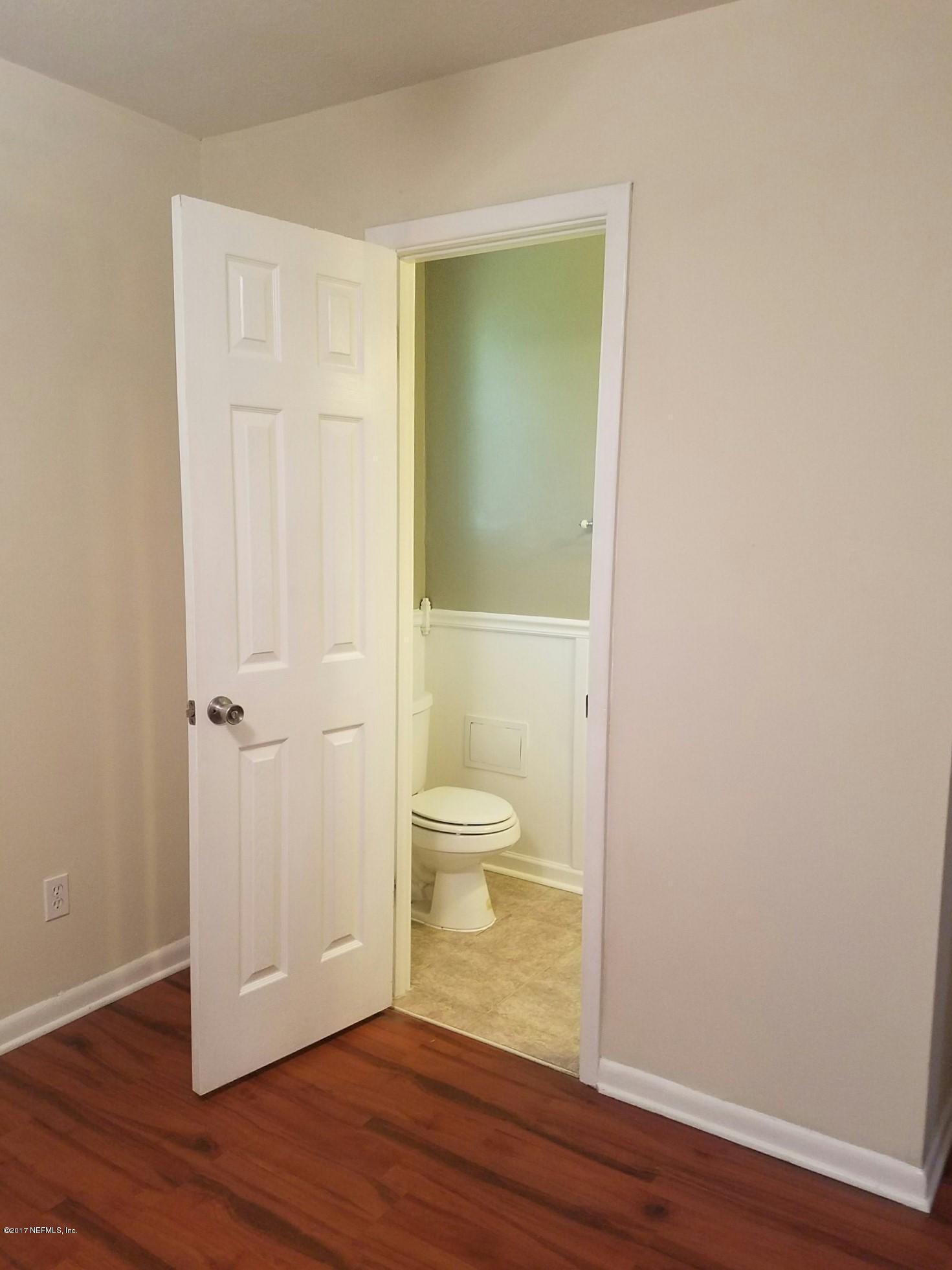 6556 Todd Road Jacksonville, FL 32216 - Photo 10 of 17 a view of a bathroom with wooden floor