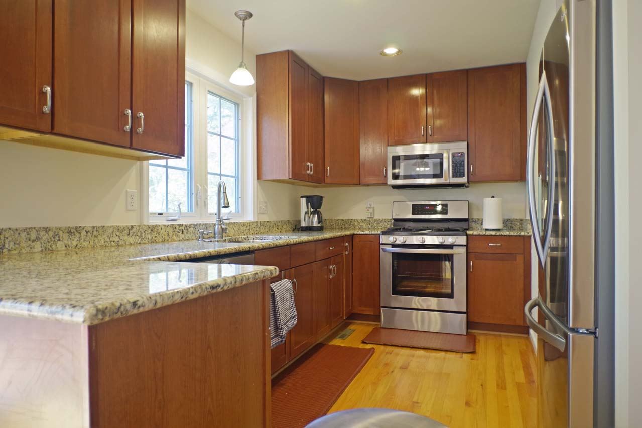 2009 Shepherds Ridge Road Charlottesville, VA 22901 - Photo 15 of 41 a kitchen with stainless steel appliances granite countertop a stove a sink and a microwave