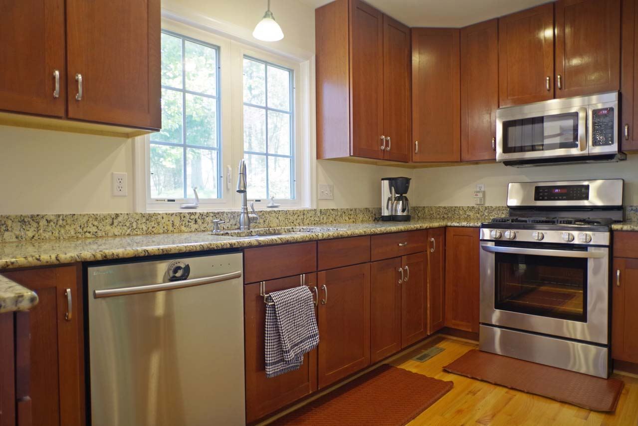 2009 Shepherds Ridge Road Charlottesville, VA 22901 - Photo 16 of 41 a kitchen with stainless steel appliances granite countertop a stove a sink and a microwave