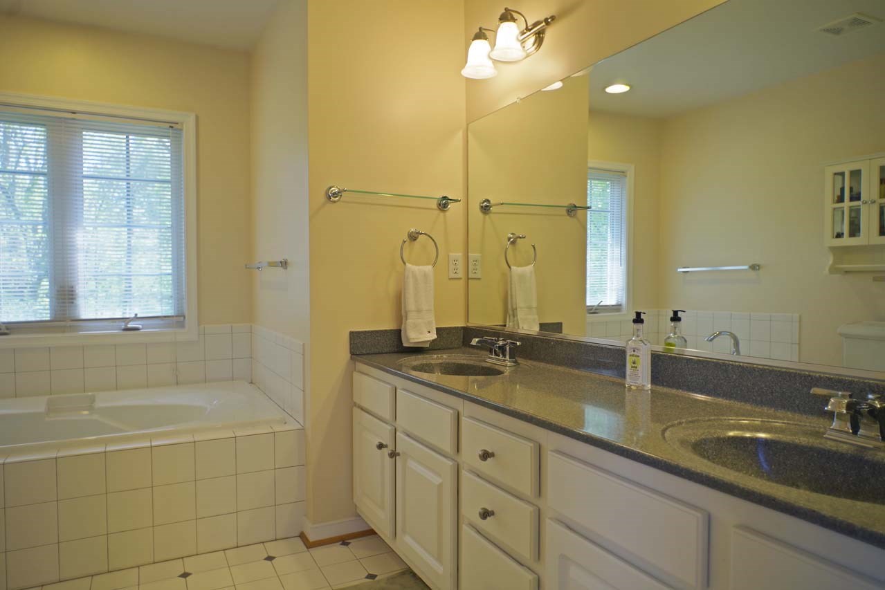 2009 Shepherds Ridge Road Charlottesville, VA 22901 - Photo 25 of 41 a bathroom with a granite countertop sink mirror and bathtub