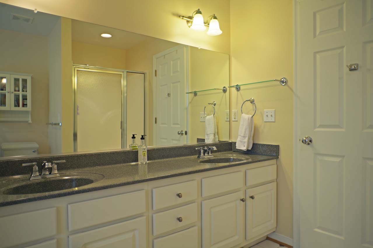 2009 Shepherds Ridge Road Charlottesville, VA 22901 - Photo 26 of 41 a bathroom with double sink and a mirror
