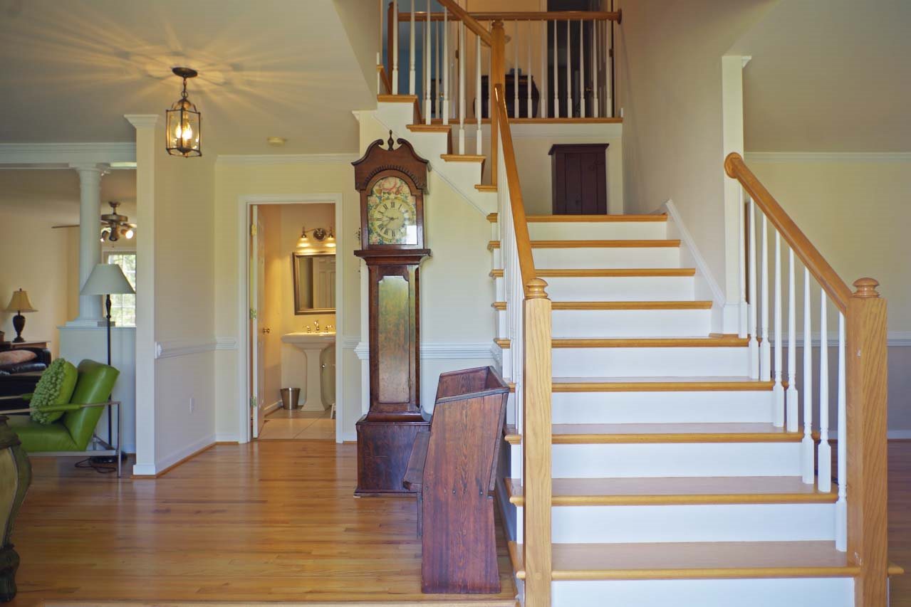 2009 Shepherds Ridge Road Charlottesville, VA 22901 - Photo 3 of 41 a view of a hallway with wooden floor and staircase