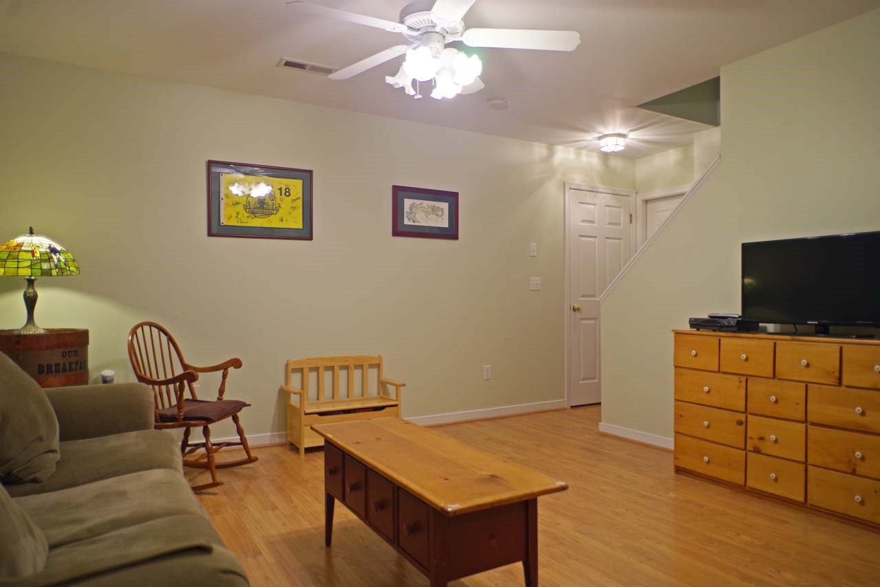 2009 Shepherds Ridge Road Charlottesville, VA 22901 - Photo 38 of 41 a living room with furniture and a flat screen tv