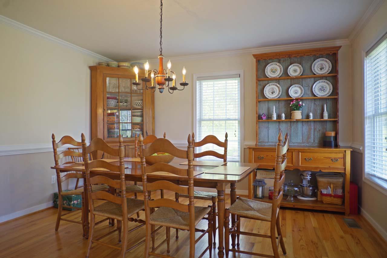 2009 Shepherds Ridge Road Charlottesville, VA 22901 - Photo 4 of 41 a view of a dining room with furniture and wooden floor