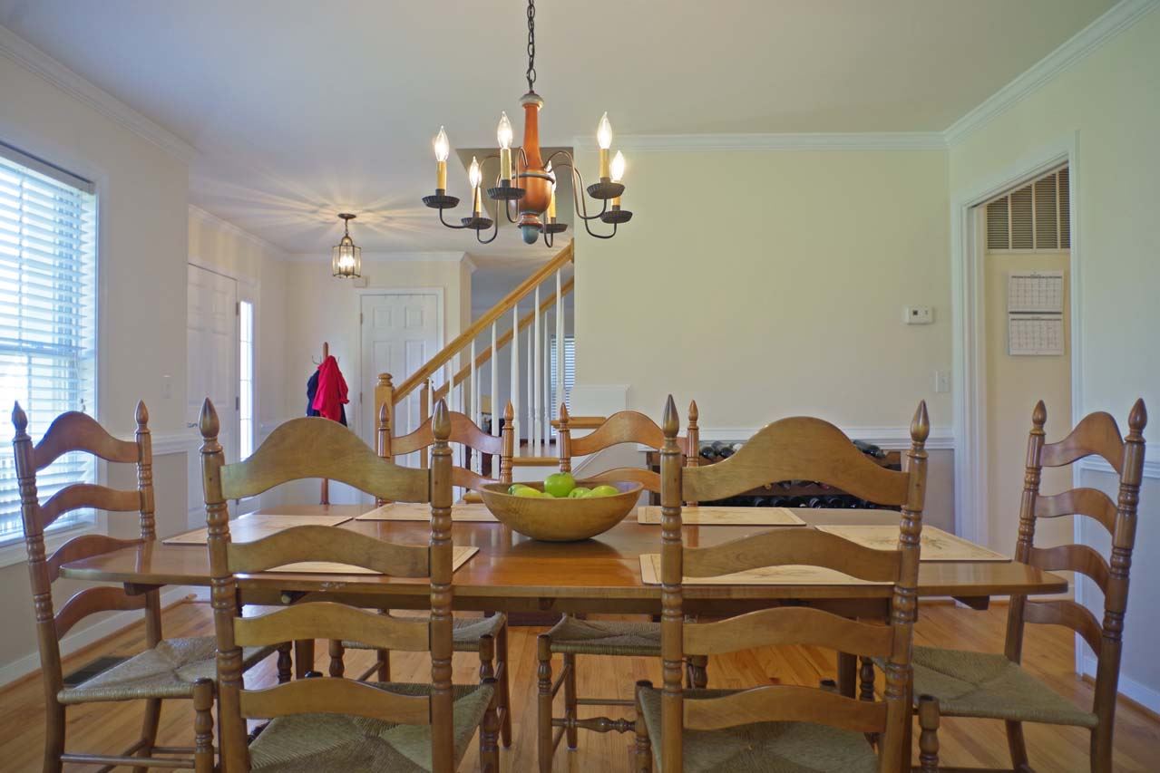 2009 Shepherds Ridge Road Charlottesville, VA 22901 - Photo 6 of 41 a view of a dining room with furniture and a chandelier