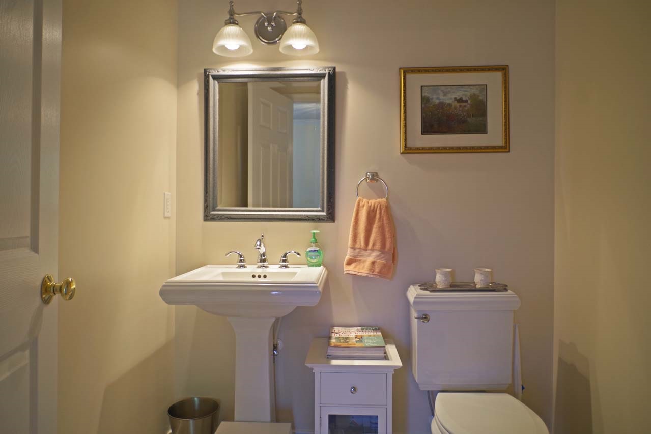 2009 Shepherds Ridge Road Charlottesville, VA 22901 - Photo 7 of 41 a bathroom with a toilet sink and mirror