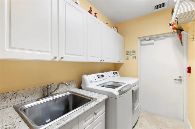 a balcony with furniture and a floor to ceiling window