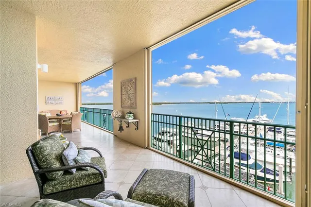 a view of a lake with boats and trees