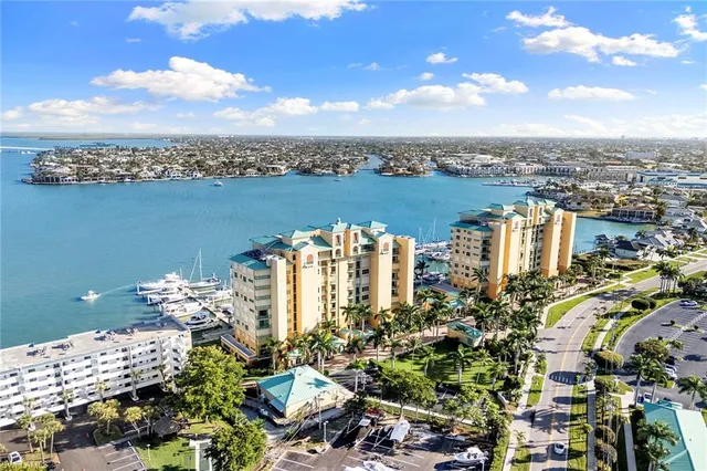 an aerial view of a city with lawn chairs