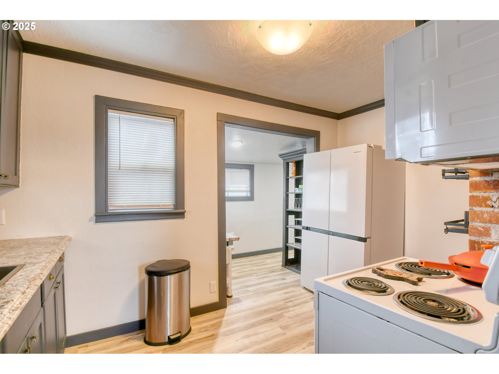709 Southwest 8th Street Pendleton, OR 97801 - Photo 10 of 24 a kitchen with stainless steel appliances granite countertop a refrigerator a stove and a sink