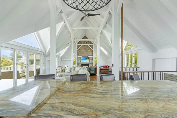 a living room with furniture and a floor to ceiling window