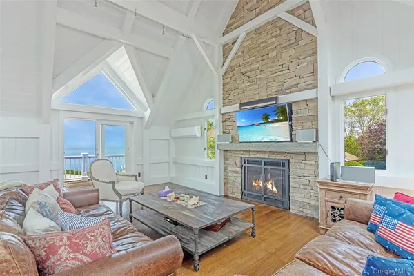 a view of a balcony with wooden floor and outdoor space