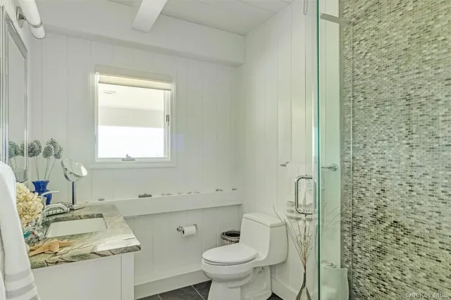 a bedroom with a bed and windows