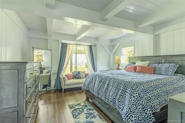 a bathroom with a granite countertop sink a toilet and a shower