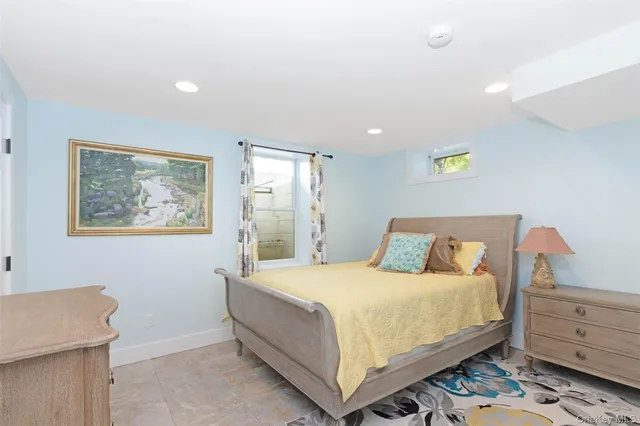 a view of a house with pool and chairs