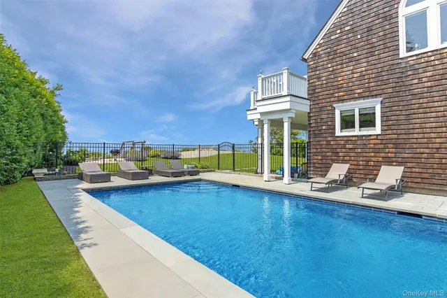a view of house with backyard and porch