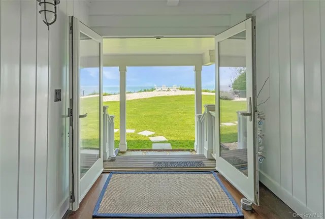 a view of a living room and a balcony